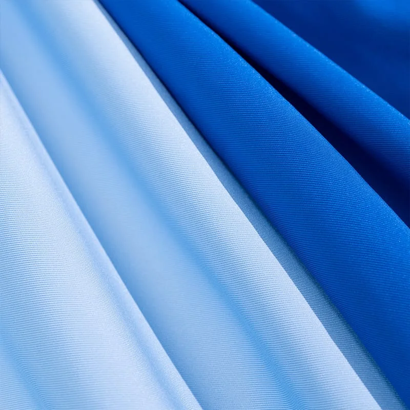 Close-up of pique fabric texture showing raised diamond pattern and breathable structure